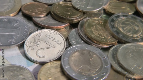 Different currency and coins as a background