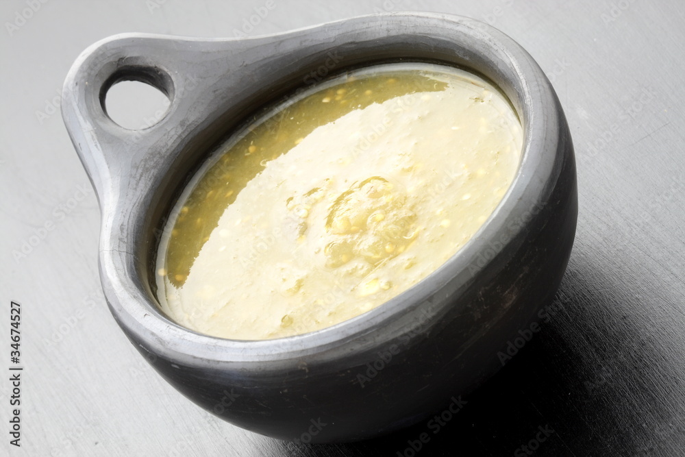 tomatillo sauce in colombian clay dish tomatillo sauce in colombian clay dish