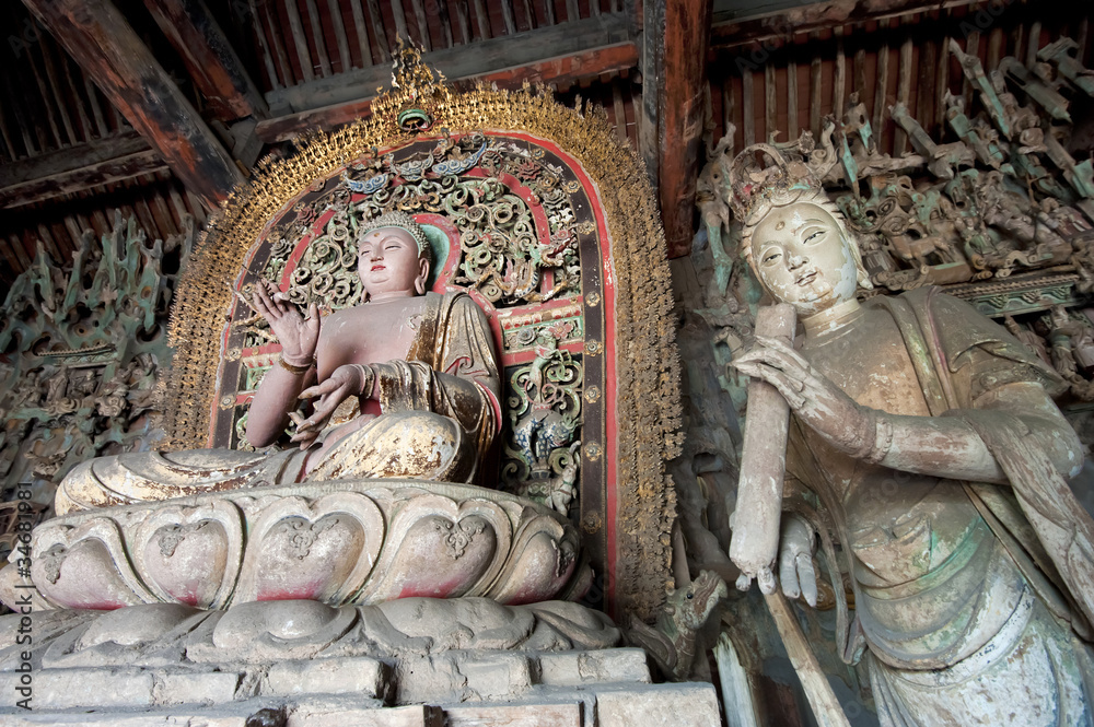 Statue of Sakyamuni buddha and female bodhisattva
