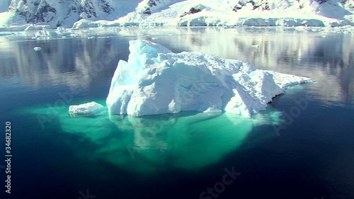 zoom out of an iceberg to antarctic landscape
