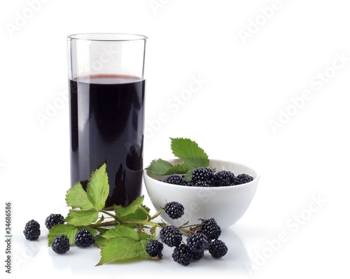 blackberry in plate and glass juice