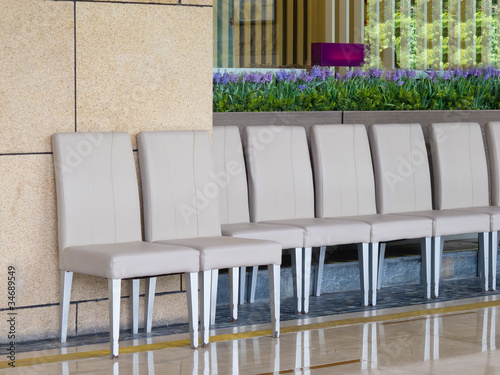 a row of chairs outside of restaurant