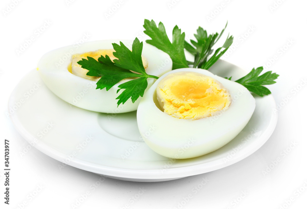 boiled egg and parsley on plate isolated on white boiled egg and parsley on plate isolated on white