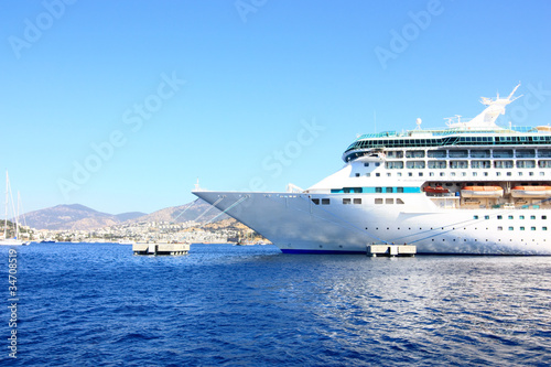 bow of a big cruise ship docked in the mediterranean