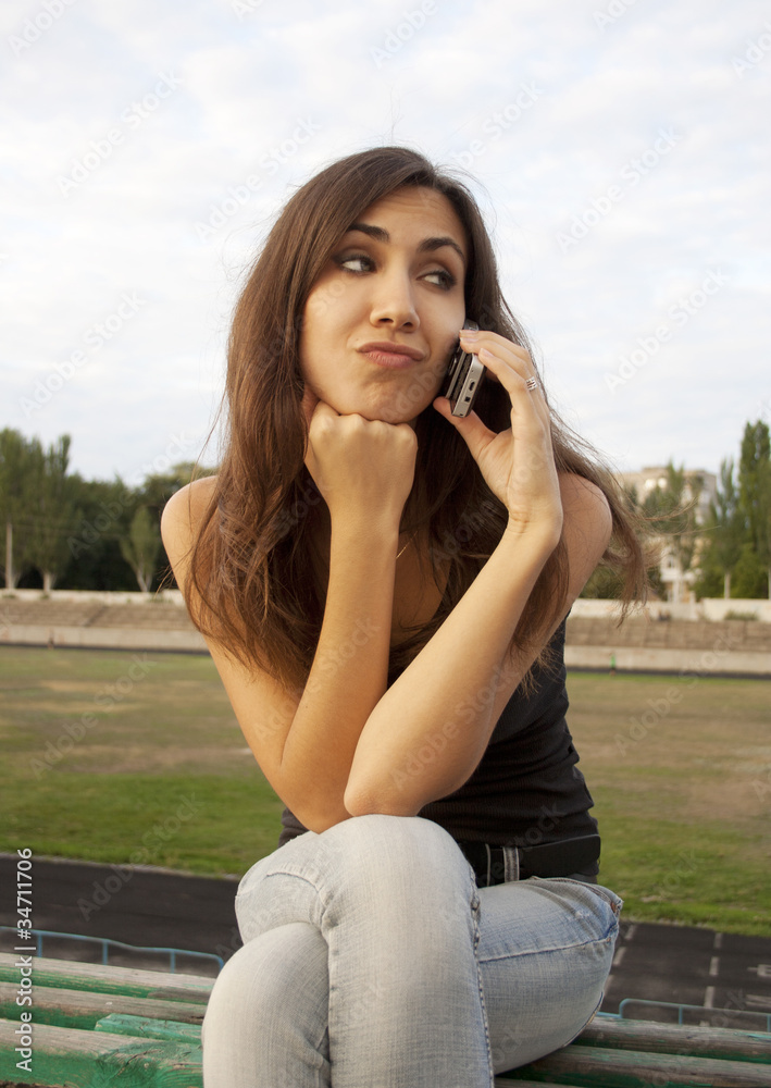 Young woman talking on the phone Young woman talking on the phone
