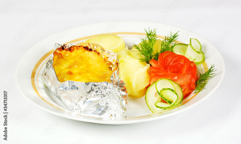 Baked Potato filled with meat and cheese on white plate