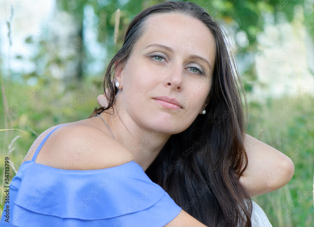 Young smiling woman outdoor in summer