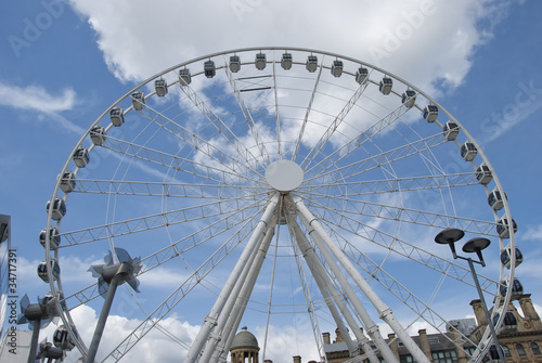 A Fairground Big Wheel under a summer sky