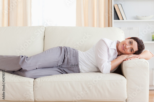 Woman lying on a sofa