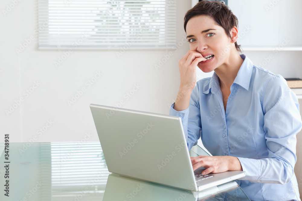 Upset brunette Businesswoman with a laptop Upset brunette Businesswoman with a laptop