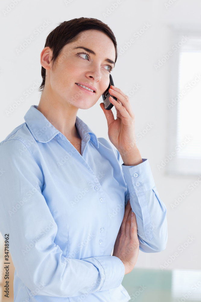 Brunette short-haired businesswoman on the phone Brunette short-haired businesswoman on the phone