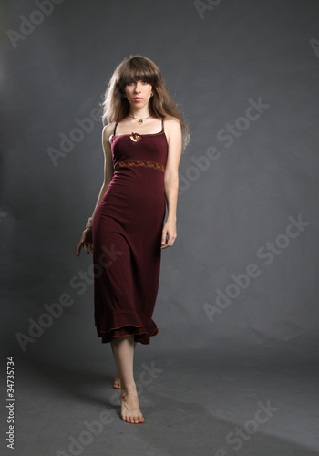 Beautiful young woman in elegance dress