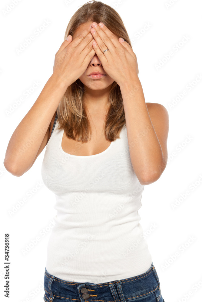 Portrait of young female in casual covering her eyes Portrait of young female in casual covering her eyes