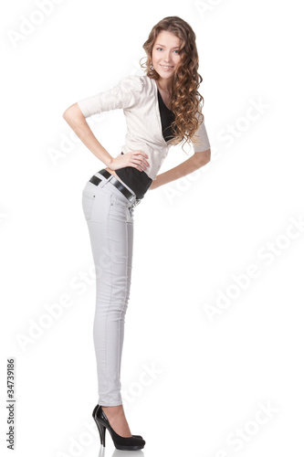 Fotografie Full length portrait of coquettish female in jeans