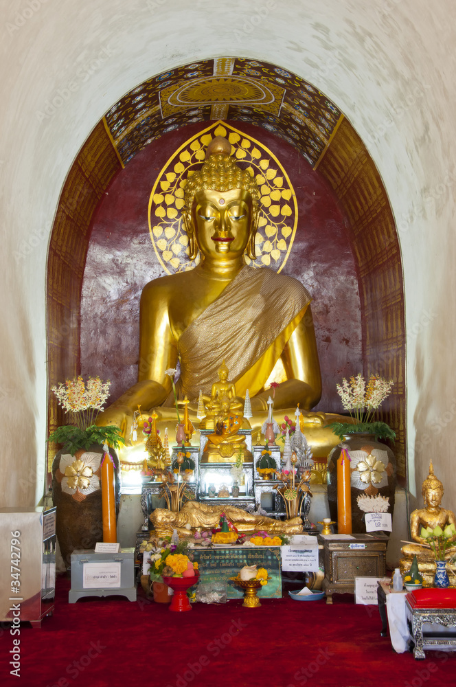 Golden Buddha in arch.
