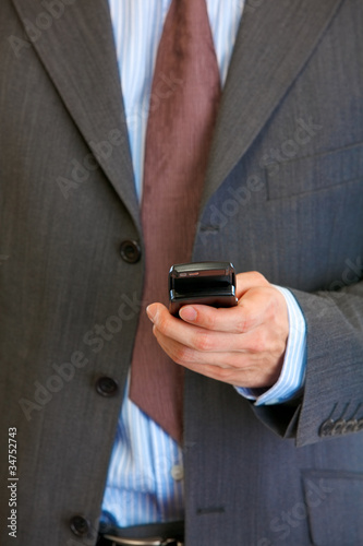 Mobile phone in man hand. Mobile communication. Close-up.