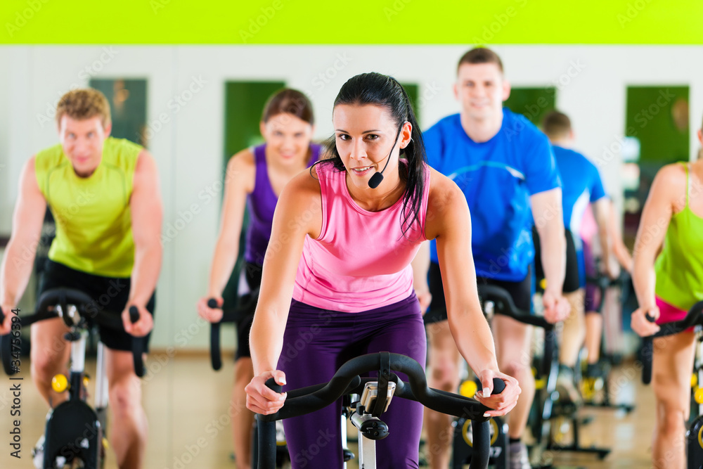 Indoor bycicle cycling in gym Indoor bycicle cycling in gym