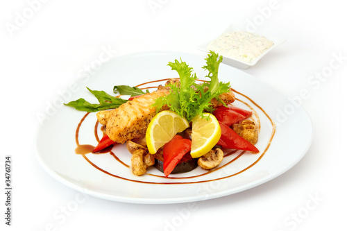 Red fish grilled with vegetables mushrooms lemon