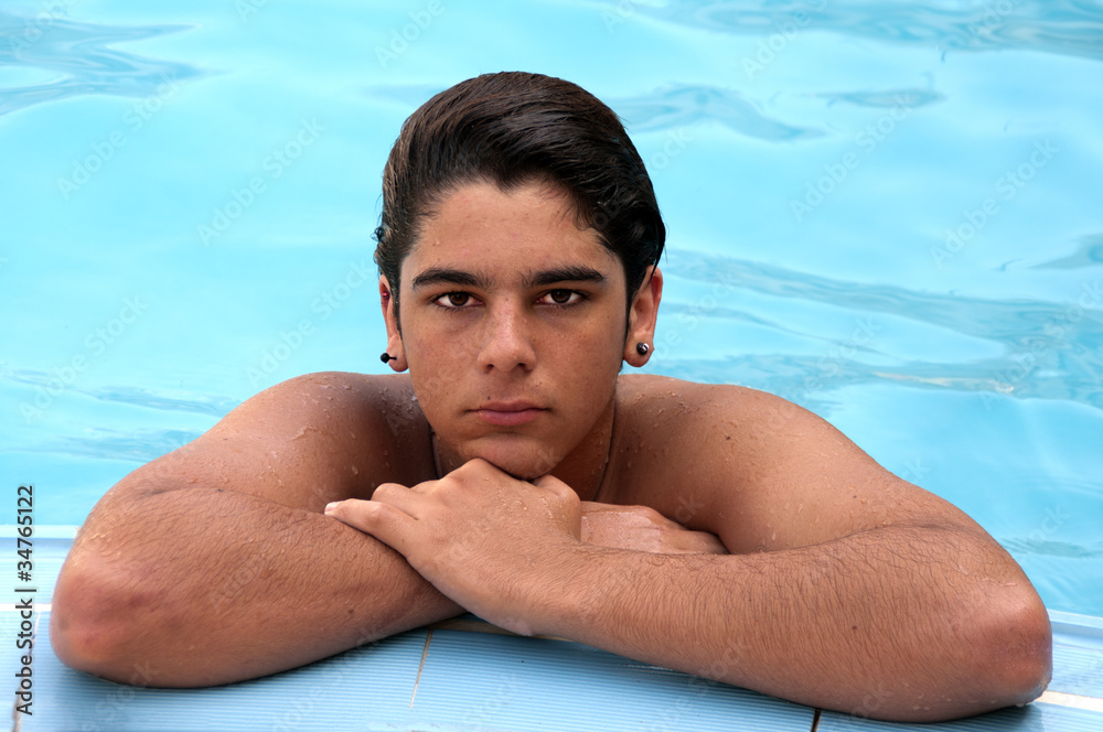 Teenage boy in swimming pool Teenage boy in swimming pool