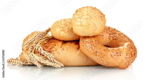 bread and buns with sesame seeds and spikelets isolated on white