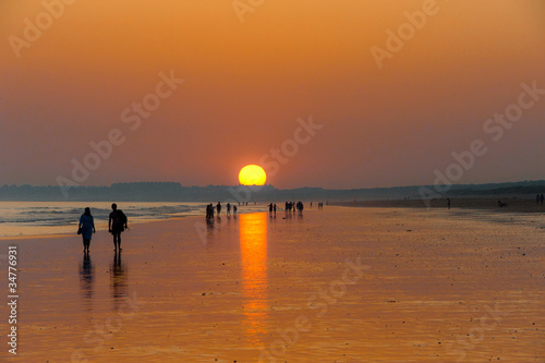 Orange sunset on the long beach © Rachwalski