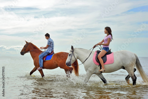 Man and a woman on horseback