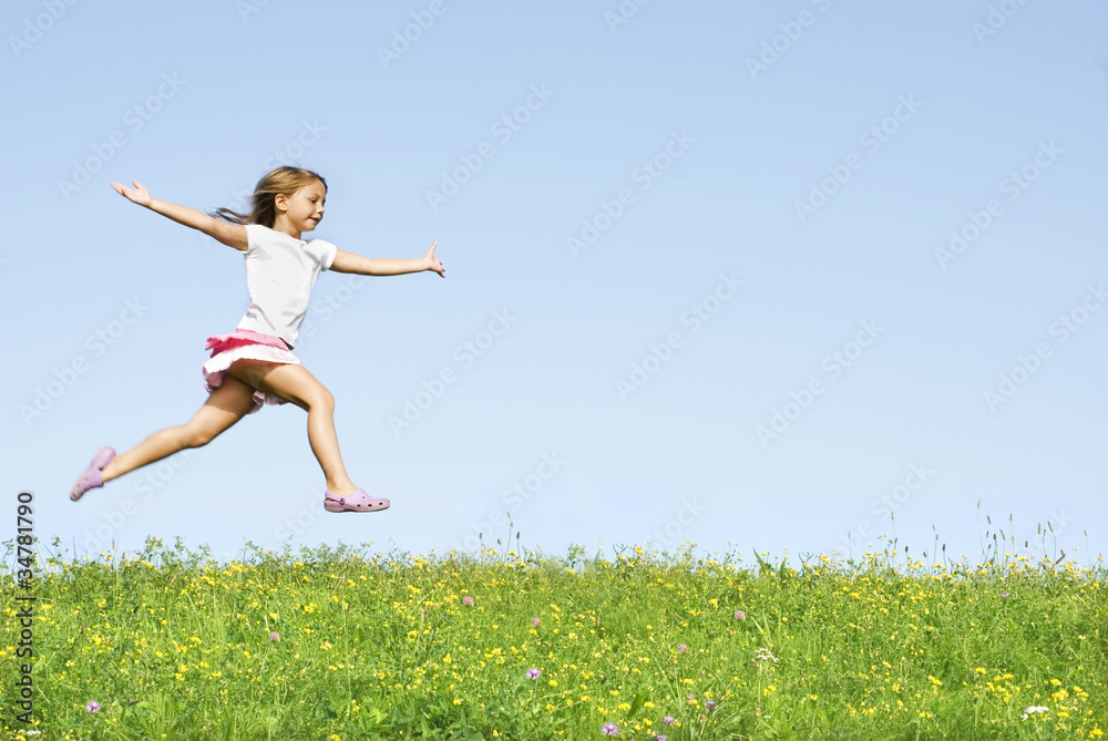 little girl jumping on meadow, she playing little girl jumping on meadow, she playing