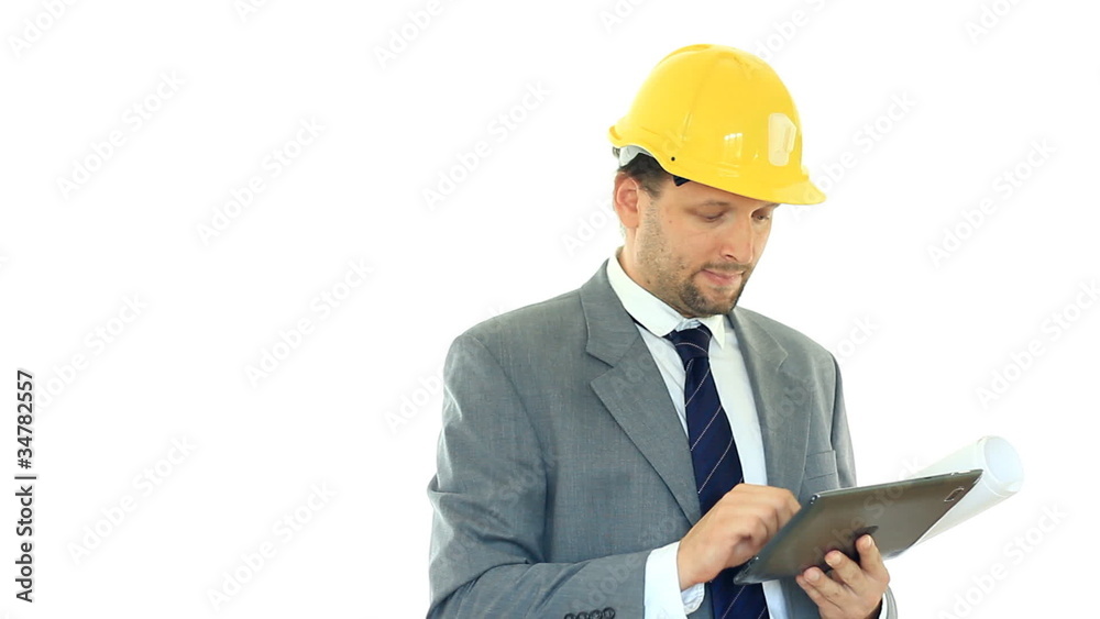 Construction engineer with tablet computer smiling, isolated Construction engineer with tablet computer smiling, isolated