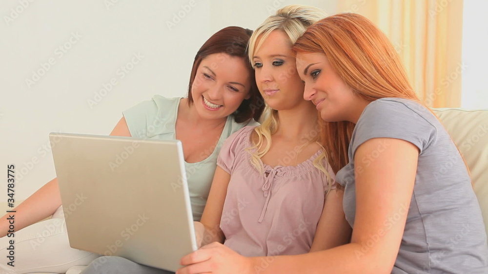 Charming friends with a laptop