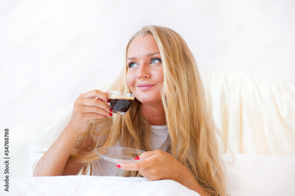 Closeup portrait of a pretty young female having a cup of coffee Closeup portrait of a pretty young female having a cup of coffee