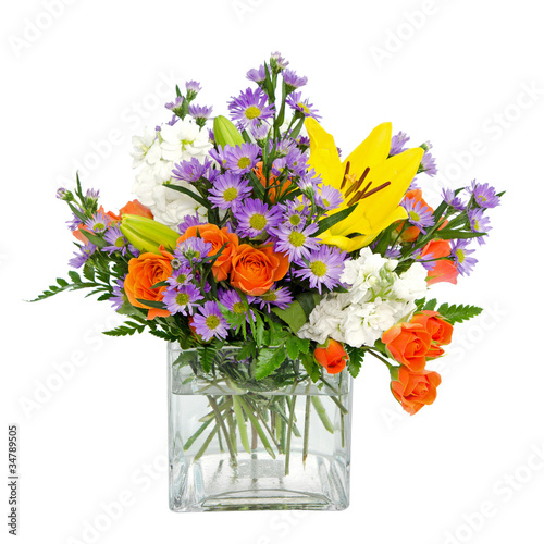 Fotografie Colorful flower arrangement centerpiece in square glass vase