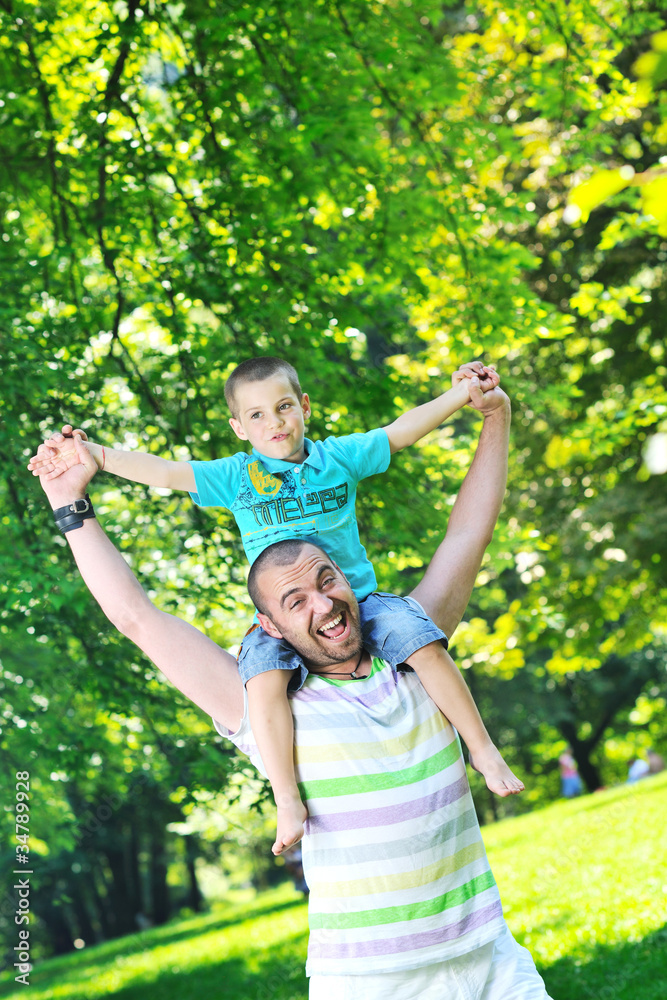 Fototapeta premium happy father and son have fun at park