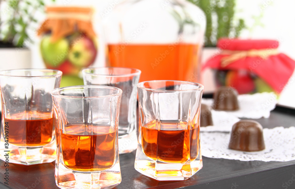 Homemade liqueur in small glasses Homemade liqueur in small glasses