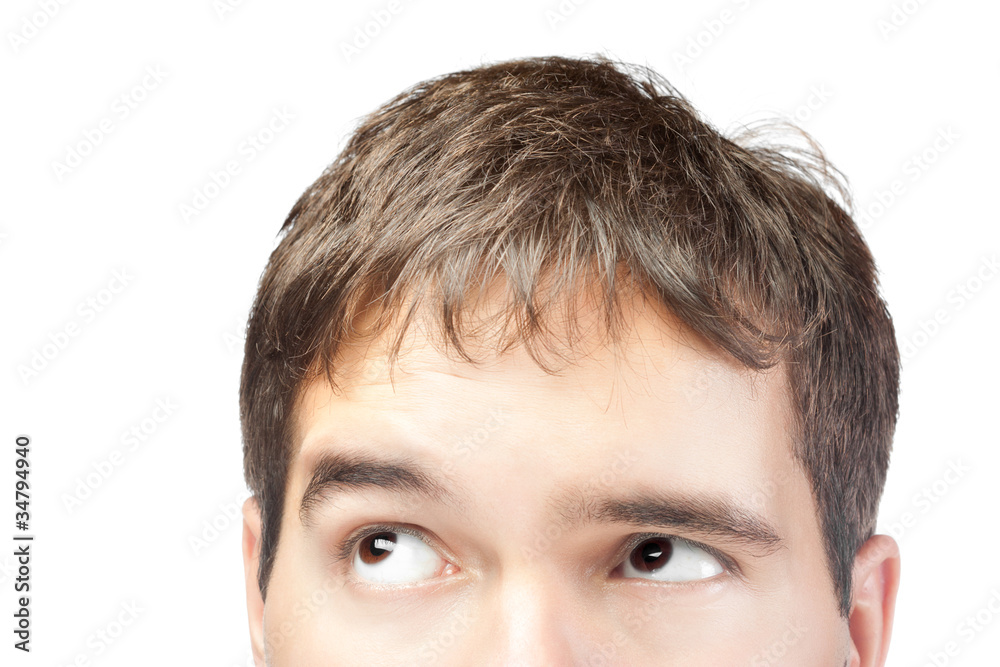 Fototapeta premium attractive young man looking up isolated on white background
