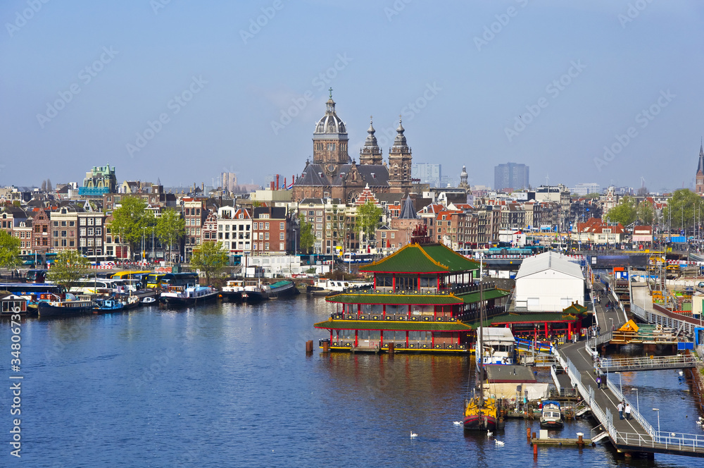 Classical Amsterdam view. Boat floats