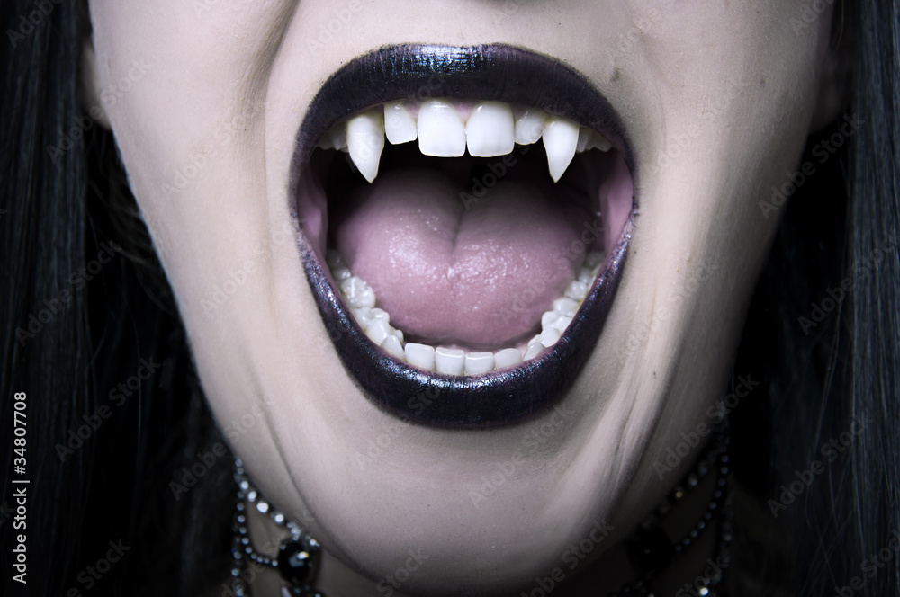 Fototapeta premium Opened vampire woman mouth closeup