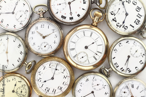 Various Antique pocket watches on white