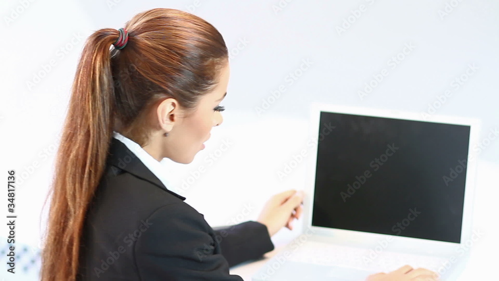 Pretty business woman sitting at the front of computer Pretty business woman sitting at the front of computer