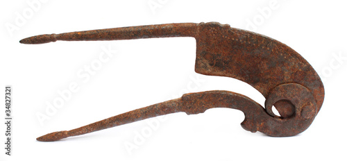 Rusty betel nut cutter over white background