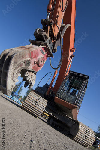 Open jaws on crusher attached to excavator