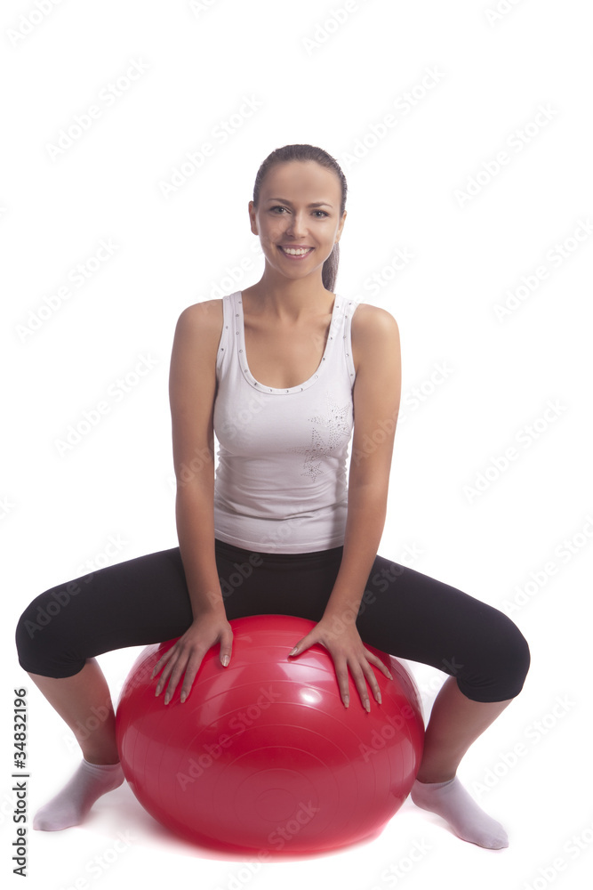 young brunette girl sitting on fitball young brunette girl sitting on fitball