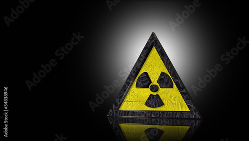 Warnschild Atomkraft in 3D vor schwarzem Hintergrund photo