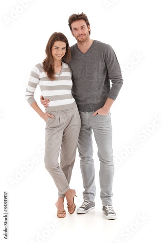 Casual young couple embracing smiling