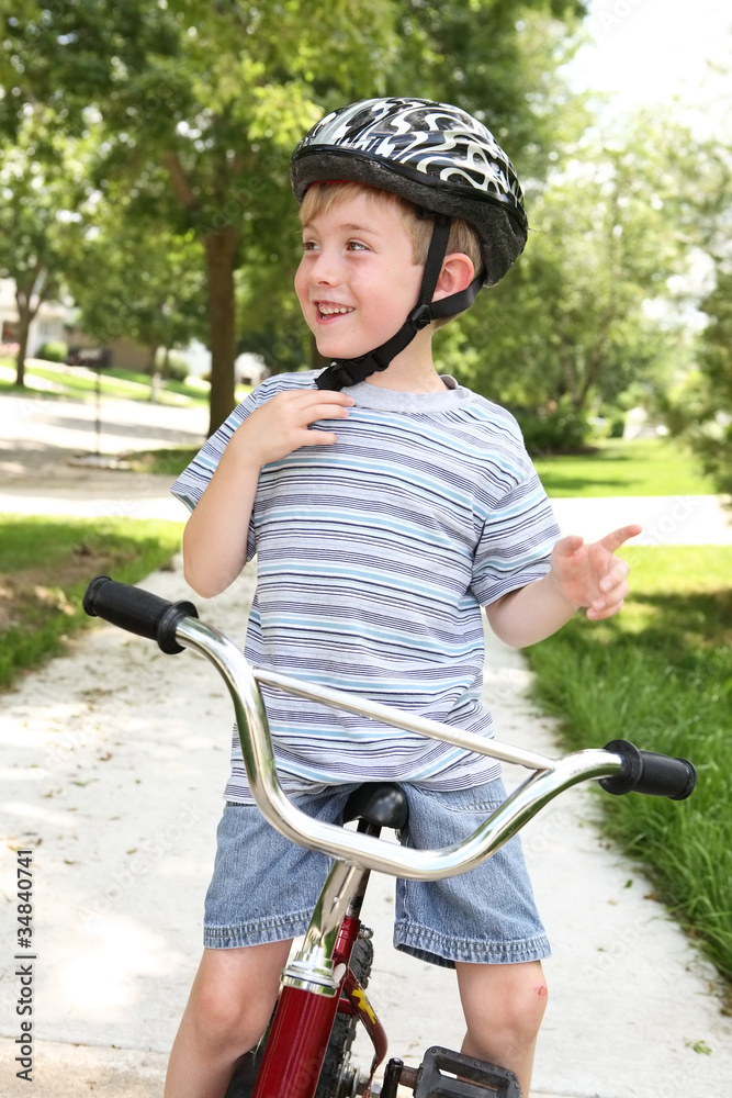 Obraz premium Young boy on a bicycle