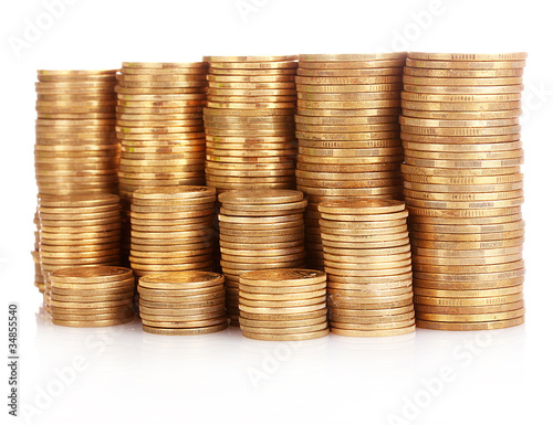 Many coins in column isolated on white