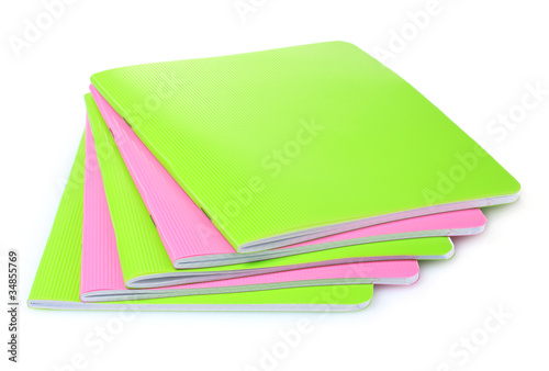 green and pink notebook isolated on white