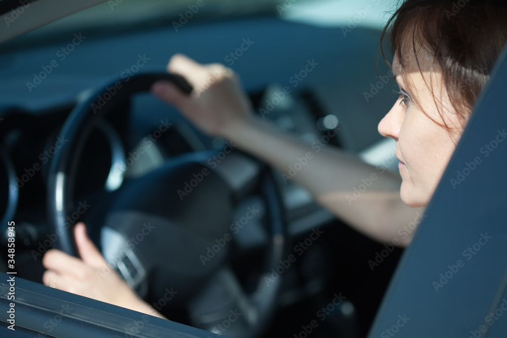 woman is driving her car