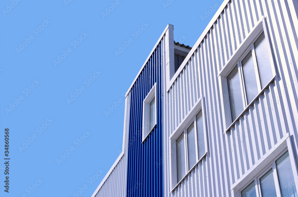Fototapeta premium White and blue office building with windows