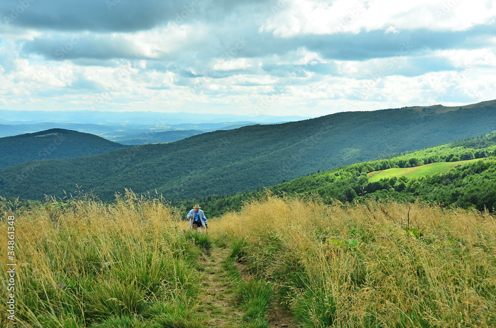 Senior tourist hiking in Bieszczady mountains, Poland Senior tourist hiking in Bieszczady mountains, Poland