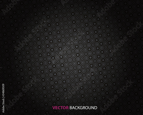 Abstract dark background with circles.